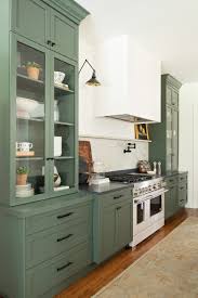 Although farmhouse kitchen paint colors often lean neutral, these color schemes aren't all about whites and wood tones. Gray Green Shaker Cabinets In A Kitchen Remodel Town Country Living