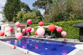 Picking a pool party theme or pool party birthday theme really comes down to the kinds of food you want to serve and the types of decor you want to incorporate into your celebration! Pink Raspberry Pool Party Balloon Installation Pool Party Balloons Pool Party Themes Pool Birthday Party