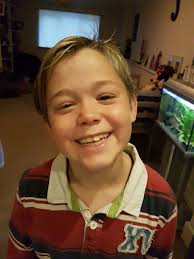 Parents furious after posh school tells their son to change his 'too light'  hair