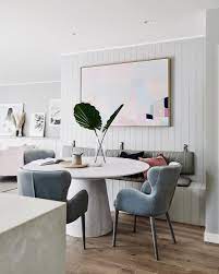 Round Dining Table With Built In Bench Seat And Large Artwork On The Wall Scandinavian Dining Room Dining Table With Bench Dining Room Colors