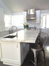 white farmhouse kitchen. carrera marble
