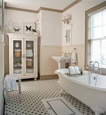Beadboard wainscoting in the bath contrasting nicely with dark gray walls and a pop of color on the tub. Bathroom With Wainscoting Design Ideas Small Design Ideas