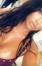 Amateur brunette strips and shows her busty tits. Lauren Goodger Puts On Very Busty Display As She Strips To Her Bra In Oiled Up Shoot