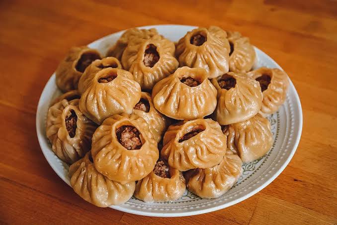 Handmade Buuz dumplings, a staple of Naadam festivities.