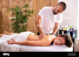 Concept of full body massage, girl having a massage Stock Photo - Alamy
