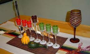 Add the kinara (candleholder) containing the mishumaa saba (seven candles). 6 Steps To Make A Diy Floral Centerpiece Diy Kwanzaa Decorations Kwanzaa Decorations Kwanzaa Crafts