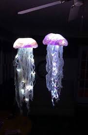 In a cute purple, seafoam green, and light blue, these decorative hanging lanterns are perfect for your child's mermaid theme party. Hanging Jellyfish Light Remote Controlled Settings Etsy In 2020 Sea Decor Jellyfish Light Jellyfish Decorations