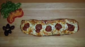 Cut the pizza in half, or into however many pieces you want. Pizza Log Picture Of Get Stuffed Deli Accra Tripadvisor
