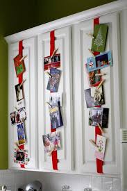 Christmas card displays come in many shapes and forms, so there's always a few things to keep in mind. Good Idea For Christmas Cards Attach Ribbon To Kitchen Cabinets Use Clothespins To Hang Cards This Is Christmas Card Display Creative Christmas Christmas