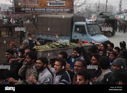 Kashmiri Muslims carry the coffin of Owais Bashir Malik, during his funeral  procession in Srinagar after the body of a college student with his throat  slit was found in Srinagar Credit: Basit