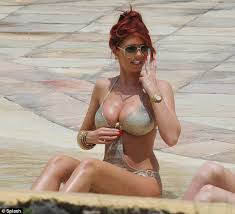 Former TOWIE star Amy Childs shows off impressive cleavage in tight gold  monokini | Daily Mail Online