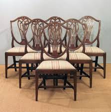 Long set of twelve antique mahogany shield back dining chairs including two carvers, all in excellent condition. Set Of Six Antique Dining Chairs Hepplewhite Dining Chairs 6 Georgian Dining Chairs Set Of 6 Shield Back Chairs Antique Mahogany Dining Chairs Antique Cha Antique Dining Chairs Dining Chairs Modern Dining Table