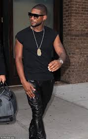 usher shows off sculpted arms in short sleeve top as he