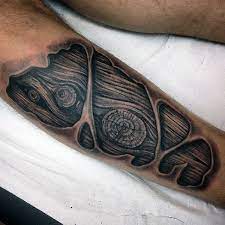 And now, this is actually the primary sample image: 50 Wood Carving Tattoo Designs For Men Masculine Ink Ideas