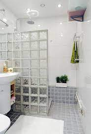 Glass block walls & windows highlight modern bath remodel. A Very Charming And Stylish Loft In Sweden Small Bathroom Makeover Bathroom Remodel Designs Bathroom Design Luxury
