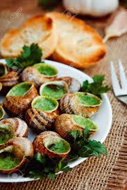 Il pleut il mouille c'est la fête à la grenouille but it's also la chasse aux escargots! Escargots De Bourgogne Snails With Herbs Butter Gourmet Dish Stock Photo Picture And Royalty Free Image Image 66295449