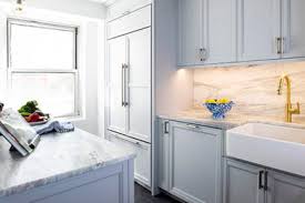 Rich hardwood floors and crisp white trim add contrast, making the cabinetry paint color read as a soft taupe. Rutt Handcrafted Cabinetry Project Photos Reviews New Holland Pa Us Houzz