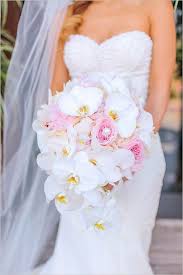 This elegant round rose wedding bouquet is made to order for your special day. Orchid And Rose Bouquet Weddingchicks Orchid Bouquet Wedding Orchid Bridal Bouquets Bride Bouquets