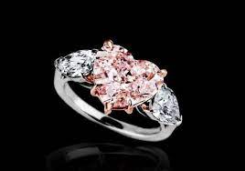4 18 Carat Pink Heart Shaped Diamond Flanked By 2 Colorless Pear Shaped Diamonds 1 58ctw Mou Heart Shaped Diamond Ring Heart Shaped Diamond Pink Diamond Ring
