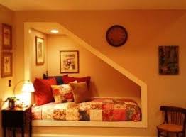 And beside the bed lay a soft mat. Under Stairs Nook Under Stairs Nook Stair Nook Master Bedroom Remodel