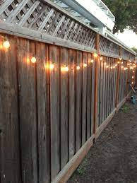 Diy Backyard Lighting Hang Lights On Your Fence Backyard Lighting Diy Outdoor Lighting Backyard Party Lighting