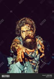 Men typically start developing facial hair in the later stages of puberty or adolescence, around fifteen years of age. Scary Zombie Man Beard Image Photo Free Trial Bigstock