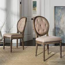 A classical baroque chair design with modern day contemporary flare. Safavieh Holloway Oval Back Dining Chair 2 Piece Set