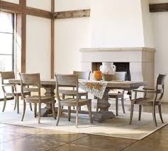 Large baluster posts with cove and ogee details, and a stretcher underneath give this table a dynamic design that's crafted to last. Banks Extending Dining Table Medium 76 112 L Grey Wash Pottery Barn