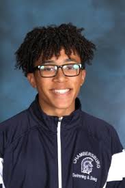 Trojan boys pick up wins in hoops and swimming, girls fall in both