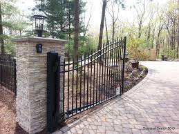 No matter how beautiful your home is from inside and outside, if the gate is not equally spectacular, it will not leave the desired impression on your guests. Stacked Stone Pillar Stone Pillars Fence Gate Metal Driveway Gates