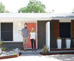 Ranch Done Right Natural Wood Shutters Charcoal Painted Brick Bright Front Door Mcm Planters Shutters Exterior Painted Brick House Painted Brick Exteriors