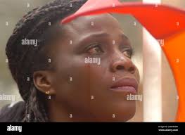 Monette Tapa of the West Indies sheds a tear during a ceremony at the William  Paca House during a slavery reconciliation walk Wednesday, Sept. 29, 2004,  in Annapolis, Md. Annapolis is the