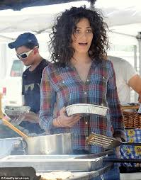 Emmy rossum has her long hair done in a big wavy style. Emmy Rossum Revisits The Eighties With Corkscrew Curls On The Set Of Her New Film Comet Daily Mail Online