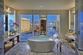 Beds sit above glass panels on the lagoon, while the outdoor tub has views of nearby mount otemanu. Hotels With Big Bathtubs For Traveling Couples