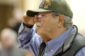 Veterans are saluted in ceremonies in the suburbs