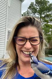 Picking blueberries from a tree