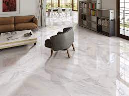 Effortlessly stylish and one of a kind, our premium stone collection brings the natural beauty of travertine, slate, marble and limestone to life in your home. Reflective Gloss White 600x600mm Carrara Marble Effect Porcelain Floor Tile Create An Uncluttered Fe Floor Tile Design Living Room Flooring Porcelain Flooring