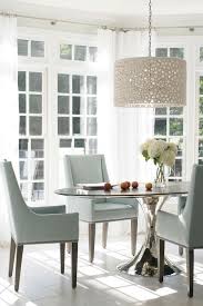 Suspended by a metal rod, this light fixture instantly creates a contemporary feel in your space. Dining Dining Room Chandelier Dining Room Design Dining Room Lighting