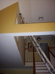The traditional way of painting a stair hallway wall all is to use a ladder at the longest length, a pair of steps on the shortest length and a scaffold board or plank going in between. Setting Up A Ladder On Stairs Fine Homebuilding
