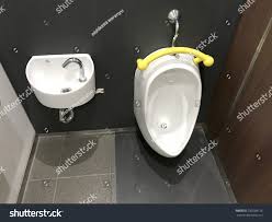 toilet young boy urinal sink hand stock