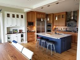 Use a strong light to carefully inspect the cabinets for areas needing additional sanding. Cherry Kitchen With A Pop Of Color Simpson Cabinetry