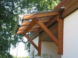 For building a wooden awning in the patio, you will need wood posts, wood beams, nuts, screws, washers, bolts, and covering sheets. Image Result For Diy Wooden Awnings Outdoor Window Awnings Wooden Canopy Patio Canopy