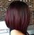 Burgundy Curly Caramel Highlights Hair