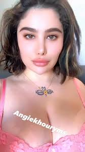 Excited Angie Khoury caressing her breasts - a private moment revealed