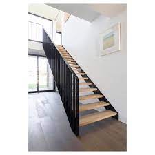 Made By S A Light Filled Open Rise And Vertical Lines On Black Steel Balustrade Steel Balustrade Black Stair Railing Stairs