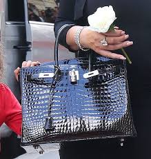 They met on a plane from paris to london in 1983. Mariah Carey Was Carrying A 30cm Hermes Black Birkin With A Glossy Crocodile Leather Finish Birkin Bag Hermes Bag Birkin Birkin