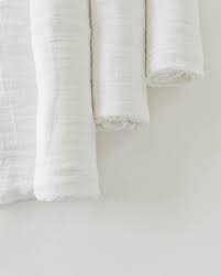 The high contrast black and white patterns enhance faster brain growth. White Muslin Swaddle Blankets Online