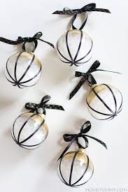 Black And Gold Christmas Decorations 20 Chic Holiday Decorating Ideas With A Black Gold And White Color Scheme Gold Christmas Decorations White Christmas Ornaments Black Christmas Trees