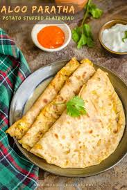 Aloo Paratha A Spicy Indian Flatbread Stuffed With Mashed Potato It Is A Filling Breakfast And Lunch With A Bowl Of Yogurt Paratha Recipes Paratha Recipes
