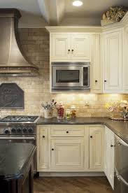 Mediterranean Kitchen Design Travertine Tile Backsplash White Cabinets Wood Flooring Mediterranean Kitchen Design Kitchen Tiles Backsplash Kitchen Design